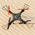 Black And Orange Quadcopter Drone With Propeller Guards On Sandy Ground 3d model