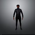 A Man Standing Against Dark Background Wearing Black Jacket Pants And Shoes