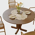 Round Wooden Dining Table Set With Rattan Backrest Chairs Lace Table Runner And Flower Vase