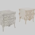 Elegant White Bedside Table With Ornate Carved Details And Two Drawers