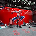 Spider Man Themed Gym Interior Featuring Fitness Equipment And Strong Is The New