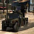 Military Camouflage Off Road Vehicle Driving On Dirt Road In Rural Area With Old Buildings