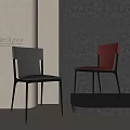 Two Modern Designer Dining Chairs With Gray And Orange Leather Seats In