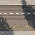 Road Facilities With White Dashed Lines Yellow Zigzag Markings And Sidewalk With Tree Shadows