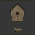Natural Wooden Birdhouse With Round Entrance And Bird Nest Containing Eggs