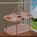 Small Baby Clothes Drying On Pink Double Layered Hanging Rack With Colorful Patterns