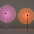 Modern Floor Lamps Projecting Pink And Orange Circular Light On Grey Wall