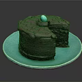 Delicious Chocolate Cake on Blue Plate with Top Blue Decorative Ball and Sliced Exposed Layers