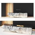 Modern Stone Reception Desk With Illuminated Sign And Warm Lighting Design