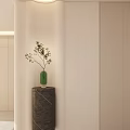 Modern Foyer Hallway Design With Light Colored Walls Stone Pillar Green Vase And Small Plant