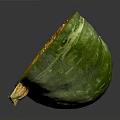 Fresh Sliced Pumpkin With Green Skin Showing Yellow Flesh And Seeds On Gray Surface
