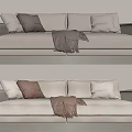 Modern Beige Two-Seater Sofa with Cozy Pillows and Dark Throw Blanket