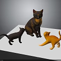 Three Cat Models in Different Colors Standing on White Board Surface