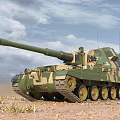 Camouflage Armored Tank With Long Barrel On Desert Terrain Under Blue Sky