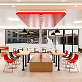 Modern Restaurant Interior With Red Black Chairs Tables Circular Colorful Wall Decor And Pendant Lights