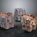 Three Natural Wooden Stone Tree Stump Stools With Textured Surfaces And Knots