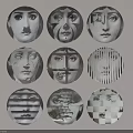 Multiple Artistic Circular Badges Featuring Abstract Black And White Face Patterns