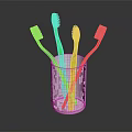 Four Colorful Toothbrushes In White Cup For Daily Hygiene Use