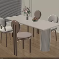 White Dining Table with Light Colored Chairs Pink Flower Vase Fruit Bowl on Fluted Base