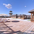 Scenic Waterfront Area With Wooden Pier Observation Tower Pavilions And Clear Blue Sky