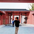 Ancient Traditional Architecture With Red Walls Black Tiled Roof Red Pillars And Courtyard