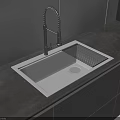 Modern Kitchen Sink With Black Curved Faucet Stainless Steel On Dark Countertop And Drainage Grill