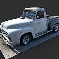 Vintage White Worn Pickup Truck Parked On Gray Concrete Ground
