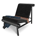 Stylish Black Velvet Lounge Chair With Metal Frame Blue Blanket And Brown Strap