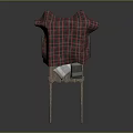 Wooden Wheelbarrow Covered With Red And Black Plaid Cloth And Blue White Items Inside