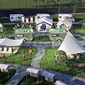 Scenic Campsite with RVs Tents Food Trucks and People Enjoying Outdoor Activities
