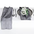 Tableware Set With Gray Napkins Silver Utensils Plate And White Flowers Green Leaves