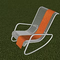 Modern Rocking Leisure Chair With Metal Frame Brown Silver Stripes On Green Surface