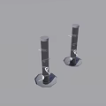 Two Black Cylindrical Devices With Hexagonal Bases Standing On Gray Background 3d model