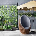 Cozy Outdoor Sofa with Wicker Frame Green Plant Wall and Umbrella in Garden