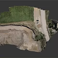 Open Pit Mine Excavation Site With Green Vegetation Sandy Ground And Access Road