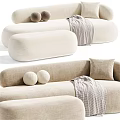Beige And Green Tiger Patterned Irregular Shaped Sofa With Round Cushions And Plaid Blanket