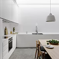 Minimalist Modern Kitchen Interior With White Cabinets Walls Pendant Light Wooden Table And Green Fruits