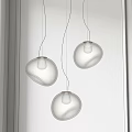 Minimalist Modern Transparent Glass Pendant Lights With Irregular Spherical Yellow Light Source Hanging White Background
