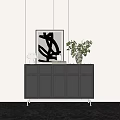 Modern Black Entryway Console Cabinet with Metal Legs and Decorative Plant Sculpture