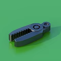 Black Metal Clamp With Serrated Edges And Holes On Green Background