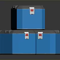 Three Blue Storage Boxes With Gray Lids And Red Labels On Reflective Surface