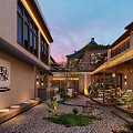 Traditional Courtyard Cafe With Thatched Roof Pebble Ground Green Plants Outdoor Seating Area Twilight