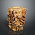 Detailed Intricate Carved Cylindrical Sculpture With Textured Surface And Artistic Patterns