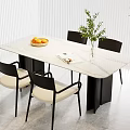 Modern White Marble Dining Table With Black Legs Four Chairs Fruit Bowl And Green Plant
