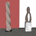 Spiral And Abstract Human Figure Sculptures On Marble Bases With Red Wall Background