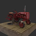 Red Satoh Tractor Displayed On Wooden Platform With Wheels And Parts