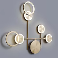 Modern Gold Metal Wall Lamp With Round Rings And Illuminated Decorative Discs