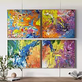 Vibrant Abstract Paintings Hanging On Wall With Potted Plant And Open Book
