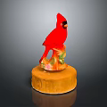Red Bird Statue Decorative Figurine With Orange Base And Floral Patterns