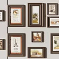 Brown Picture Frames With Various Art Prints On Gray Wall 3d model